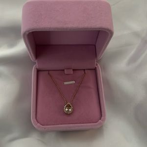 14 karat gold, white diamonds, a pink stone